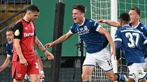 Third-tier Arminia Bielefeld stunned defending champions Bayer Leverkusen to reach the final of the German Cup.