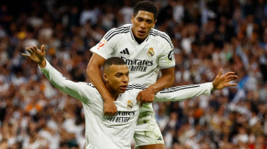 Kylian Mbappe scored twice as Real Madrid held off a spirited Celta Vigo fightback to move back to within four points of La Liga leaders Barcelona before El Clasico next weekend.