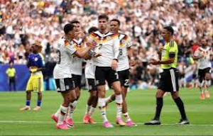 Four-time winners Germany overcame a brief scare from World Cup debutants Curacao before turning on the style to win their Group E opener in Houston.