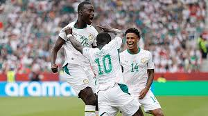 Senegal boosted their chances of reaching the knockout stage of the World Cup with a 5-0 victory against 10-man Iraq.