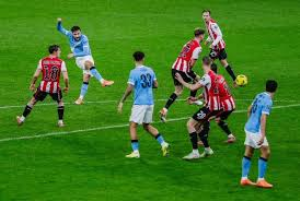 Rayan Cherki's thunderbolt strike helped Manchester City overcome Brentford to reach the semi-finals of the Carabao Cup.