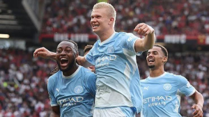 Erling Haaland's goal helped Manchester City win a highly controversial Manchester derby at rivals Manchester United despite playing with 10 men for more than 70 minutes.