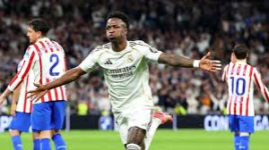 Vinicius Jr scored twice as Real Madrid won a thrilling derby against city rivals Atletico to restore the gap on La Liga leaders Barcelona to four points.
