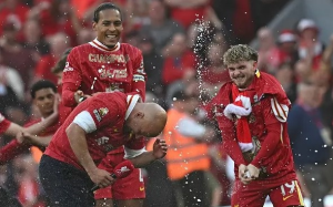 Liverpool were crowned Premier League champions in style - and drew level with Manchester United on 20 titles - as Tottenham Hotspur were demolished on a day of wild celebrations and emotion at Anfield.