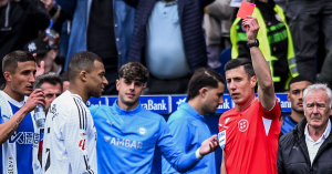 Kylian Mbappe was sent off for the first time in his Real Madrid career but his team-mates held on to defeat Alaves and move back to within four points of La Liga leaders Barcelona.