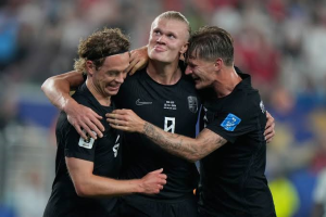 Erling Haaland scored twice as Norway booked their place in the last 32 of the World Cup with victory over Senegal in New Jersey.