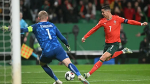 Cristiano Ronaldo scored and missed a penalty as Portugal edged a thrilling encounter with Denmark to reach the Nations League semi-finals.