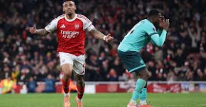 Yerson Mosquera's stoppage-time own goal gave Premier League leaders Arsenal victory over bottom of the table Wolves in a dramatic finish at Emirates Stadium.