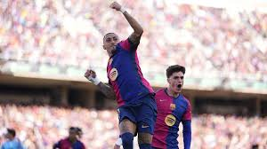 Raphinha scored a penalty in the eighth minute of stoppage time as La Liga leaders Barcelona completed a remarkable comeback to beat Celta Vigo 4-3.