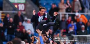 Burnley clinched promotion back to the Premier League with a win that also sent Leeds United up and consigned Sheffield United to the Championship play-offs.