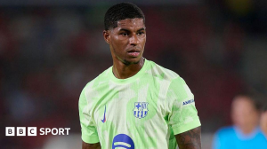 Marcus Rashford made his competitive debut as Barcelona started their La Liga title defence with a controversial victory at nine-man Mallorca.