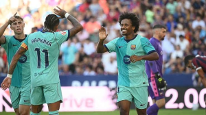 Barcelona survived a late fightback from Levante to continue their perfect start to the La Liga campaign and move three points clear of Real Madrid at the top of the table.
