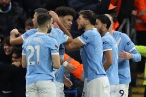 Manchester City moved to within two points of Premier League leaders Arsenal with a tense victory against Newcastle United at Etihad Stadium.