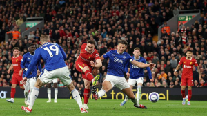 Liverpool claimed bragging rights on Merseyside with victory over rivals Everton and edged closer to lifting the Premier League title.