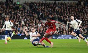 Alexander Isak came off the bench to score for Liverpool but was forced off with injury as the Reds won a chaotic Premier League match at nine-man Tottenham.