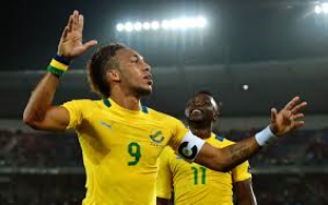 Pierre-Emerick Aubameyang scored all four goals in Gabon's 4-3 away win over The Gambia to extend his nation's hopes of reaching the World Cup for the first time - but was then sent off late on.