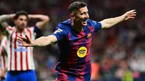 Veteran striker Robert Lewandowski scored an 87th-minute winner for Barcelona against 10-man Atletico Madrid, sending his side seven points clear at the top of Spain's La Liga.