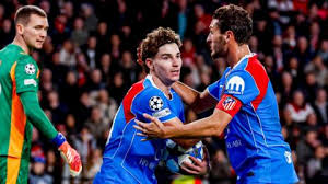 Atletico Madrid held on to claim a narrow win over PSV in an entertaining Champions League game at Philips Stadion.