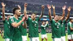 Mexico cruised into the last 16 of the World Cup with a comfortable victory over Ecuador in a weather-delayed contest at the Azteca Stadium.