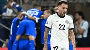 Germany suffered a surprise defeat away to Slovakia in their opening World Cup qualifier in Bratislava.