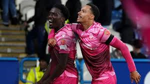 Bolton staged a stunning late fightback to beat promotion rivals Huddersfield and secure their first away win since April.
