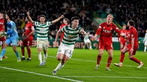 Wilfried Nancy's much-needed first win as Celtic manager arrived in incredible fashion as late goals by Kieran Tierney and James Forrest secured a deserved victory over 10-man Aberdeen in a breathtaking Scottish Premiership encounter.